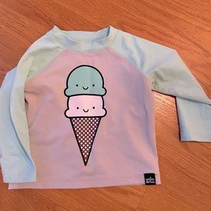 Rash guard by Whistle and Flute